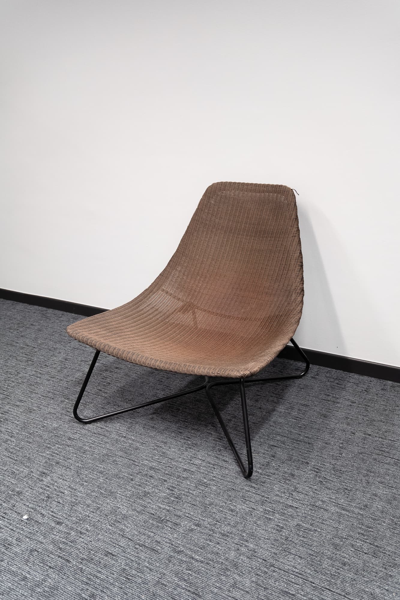 Dark brown wicker armchair