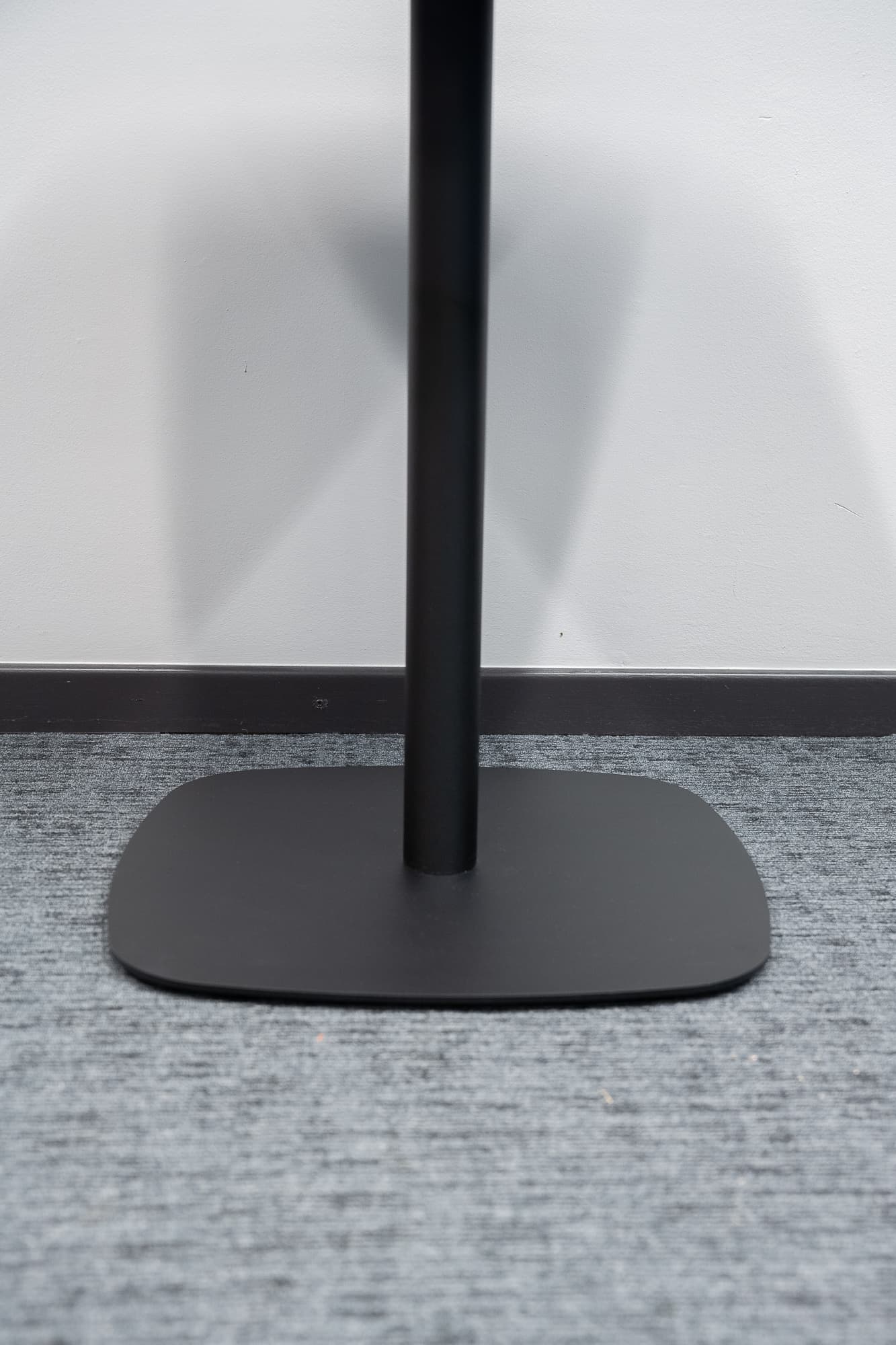 Black square iron table designed by Estudi Manel Molina